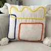 Housse-de-coussin-artisanale-a-pompons-Tafoukt-orange-